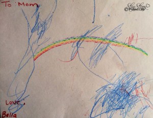 Bella drew this at daycare weeks prior to her departure. She made the rainbow with a special crayon, which is incredible considering at 18 month old all she was capable of was scribbling. The scribble on the side looks like an angel.